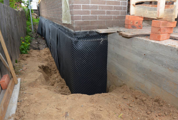 Happy homeowners after waterproofing job in Perry